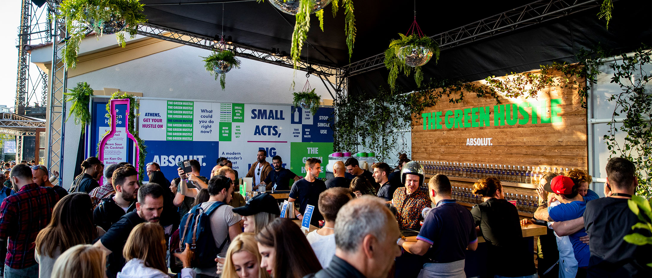 The Green Hustle bar with a crowd of people