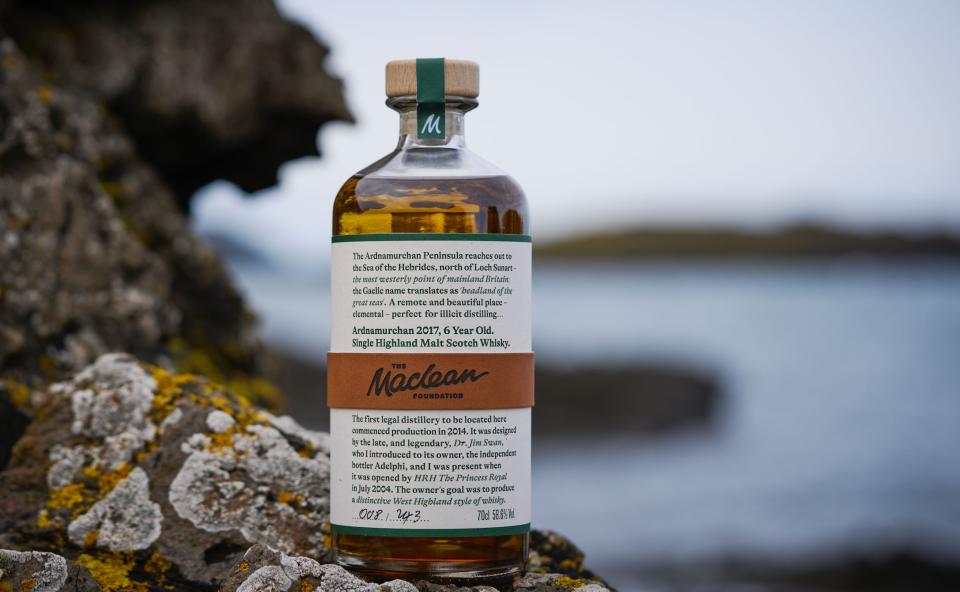 A bottle of whisky on a rock in Scotland